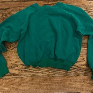 green sweatshirt GOAT